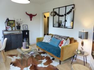 Predel za sedenje v nastanitvi PROCE - Apt lumineux et cosy, vue parc de Procé