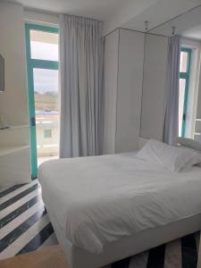 Postel nebo postele na pokoji v ubytování Hotel Excelsior