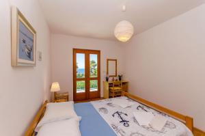 Postel nebo postele na pokoji v ubytování Apartments Josip