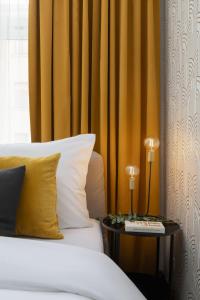 a bedroom with a bed and a side table with a side table at Apartment Pekarska 29 by Goodnite cz in Brno