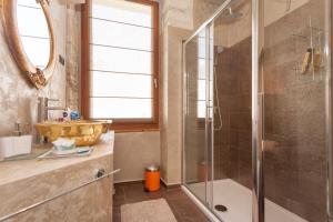 a bathroom with a sink and a shower at Apartment Lux Rovinj in Rovinj +9 photos