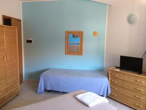 Letto o letti in una camera di Hotel Il Triangolo