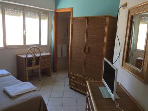 Letto o letti in una camera di Hotel Il Triangolo