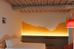 A bed or beds in a room at Mastrojanni Relais