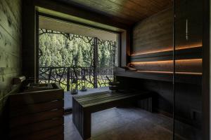 a room with a window with a bench and a balcony at SILENA, your soulful hotel - adults only in Valles +115 photos