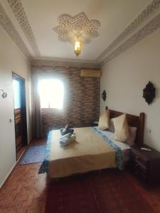 Postel nebo postele na pokoji v ubytování Riad Andalousse
