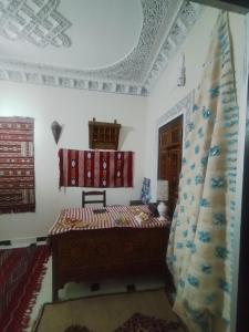 Postel nebo postele na pokoji v ubytování Riad Andalousse