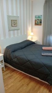 Postel nebo postele na pokoji v ubytování Inalpi Arena Apartment Virgilio - SANTA RITA - STADIO OLIMPICO