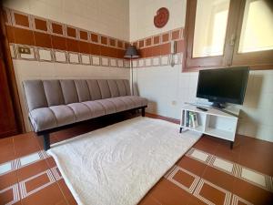 TV a/nebo společenská místnost v ubytování Armonia