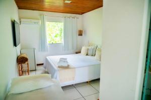 Letto o letti in una camera di Pousada Coco Dendê