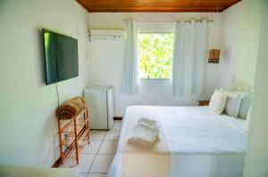Letto o letti in una camera di Pousada Coco Dendê