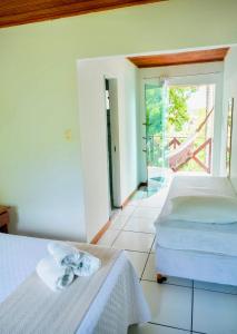 Letto o letti in una camera di Pousada Coco Dendê