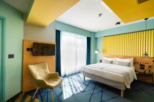 Giường trong phòng chung tại ibis Styles Bucharest Erbas +111 ảnh