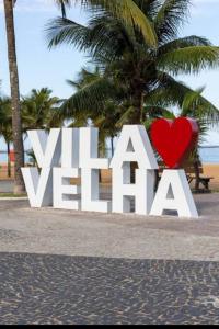 a large white sign with a red heart at Casa ampla Praia da Costa - Centro 500 mts da Praia in Vila Velha