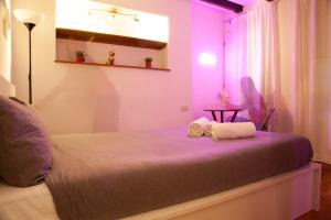 Postel nebo postele na pokoji v ubytování RRRapido Home in Brera - Via Mercato