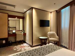 Televiisor ja/või meelelahutuskeskus majutusasutuses Macau Masters Hotel