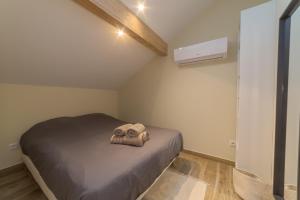 a bedroom with a bed with a towel on it at Pasteur Collection - Cozy & Warm - 4pers in Villeurbanne