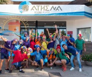 a group of people posing for a picture in front of a store at casavacanzekastalia in Ragusa