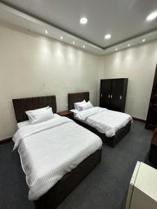 Postel nebo postele na pokoji v ubytování Tahrir Square Motel