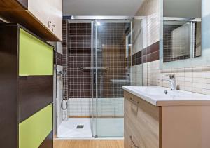 a bathroom with a glass shower and a sink at Nice sea view in Roquetas de Mar +6 photos