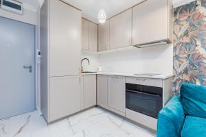 Kuchyň nebo kuchyňský kout v ubytování Apartament Zegrzyński z widokiem