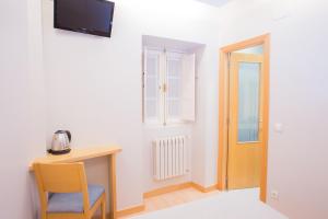 Televízia a/alebo spoločenská miestnosť v ubytovaní Casa Celsa-Barbantes