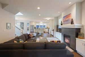 a living room with a couch and a fireplace at Hillside Haven in Bend