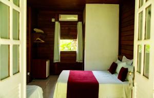 Letto o letti in una camera di Pousada Coco Dendê
