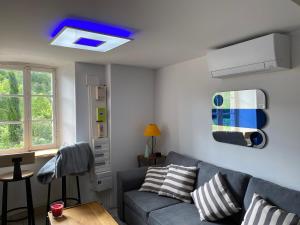 Posezení v ubytování Maison climatisée au centre du village + 6 fotografií