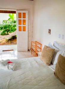 Letto o letti in una camera di Pousada Coco Dendê