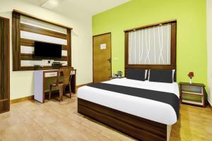 Postel nebo postele na pokoji v ubytování Super Hotel O Porvorim Near Mall De Goa