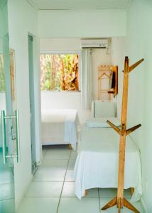 Letto o letti in una camera di Pousada Coco Dendê