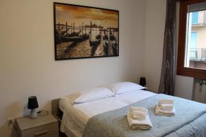 A bed or beds in a room at VENICE Sweet Home - your home in a beautiful neighborhood of the City of Venice