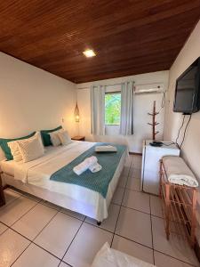 Letto o letti in una camera di Pousada Coco Dendê