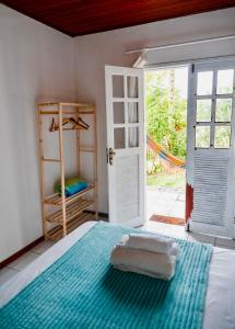 Letto o letti in una camera di Pousada Coco Dendê