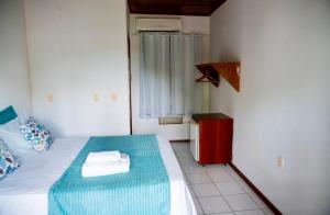 Letto o letti in una camera di Pousada Coco Dendê