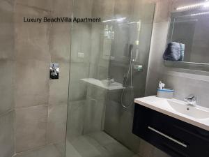 a bathroom with a shower and a sink at Luxury Beach Villa, Praia de Chaves, Boa Vista in Boa Ventura +55 photos