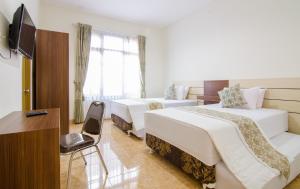 Ένα ή περισσότερα κρεβάτια σε δωμάτιο στο shakila guest house