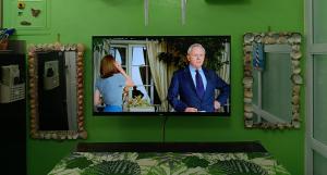 a picture of a man in a suit in a mirror at Uncle's Tagaytay Staycation in Iruhin +3 photos