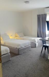 Postel nebo postele na pokoji v ubytování Nomads Hotel Petra