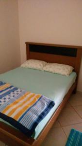 Una cama o camas en una habitación de Chácara Refúgio