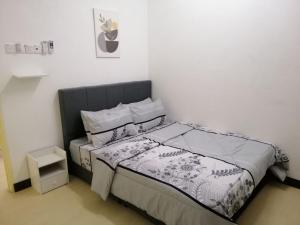 Postel nebo postele na pokoji v ubytování casa610 HOMESTAY PD