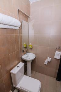 a bathroom with a toilet and a sink at Miiza Realtors in Nairobi +29 photos