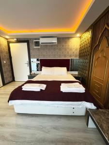 A bed or beds in a room at Akayda Butik Hotel