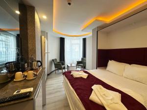 Postel nebo postele na pokoji v ubytování Akayda Butik Hotel + 37 fotografií