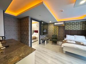 A bed or beds in a room at Akayda Butik Hotel