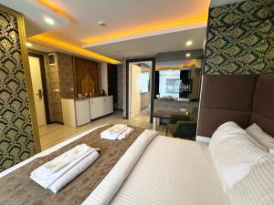 A bed or beds in a room at Akayda Butik Hotel