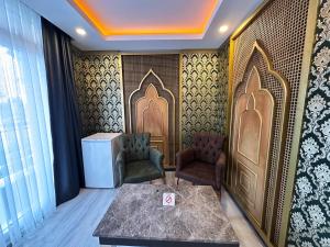 A bed or beds in a room at Akayda Butik Hotel