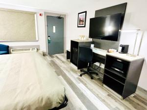 Televiisor ja/või meelelahutuskeskus majutusasutuses Quality Inn Raynham - Taunton