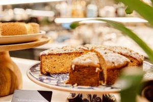 a piece of cake on a plate on a table at Radisson Blu Hotel, Madrid Prado in Madrid